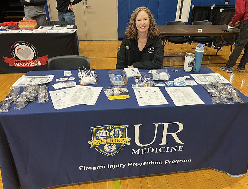 Jennifer West at health fair table