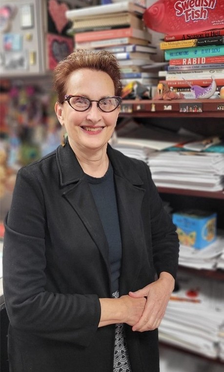 Jade Sundberg standing by a shelf with supplies