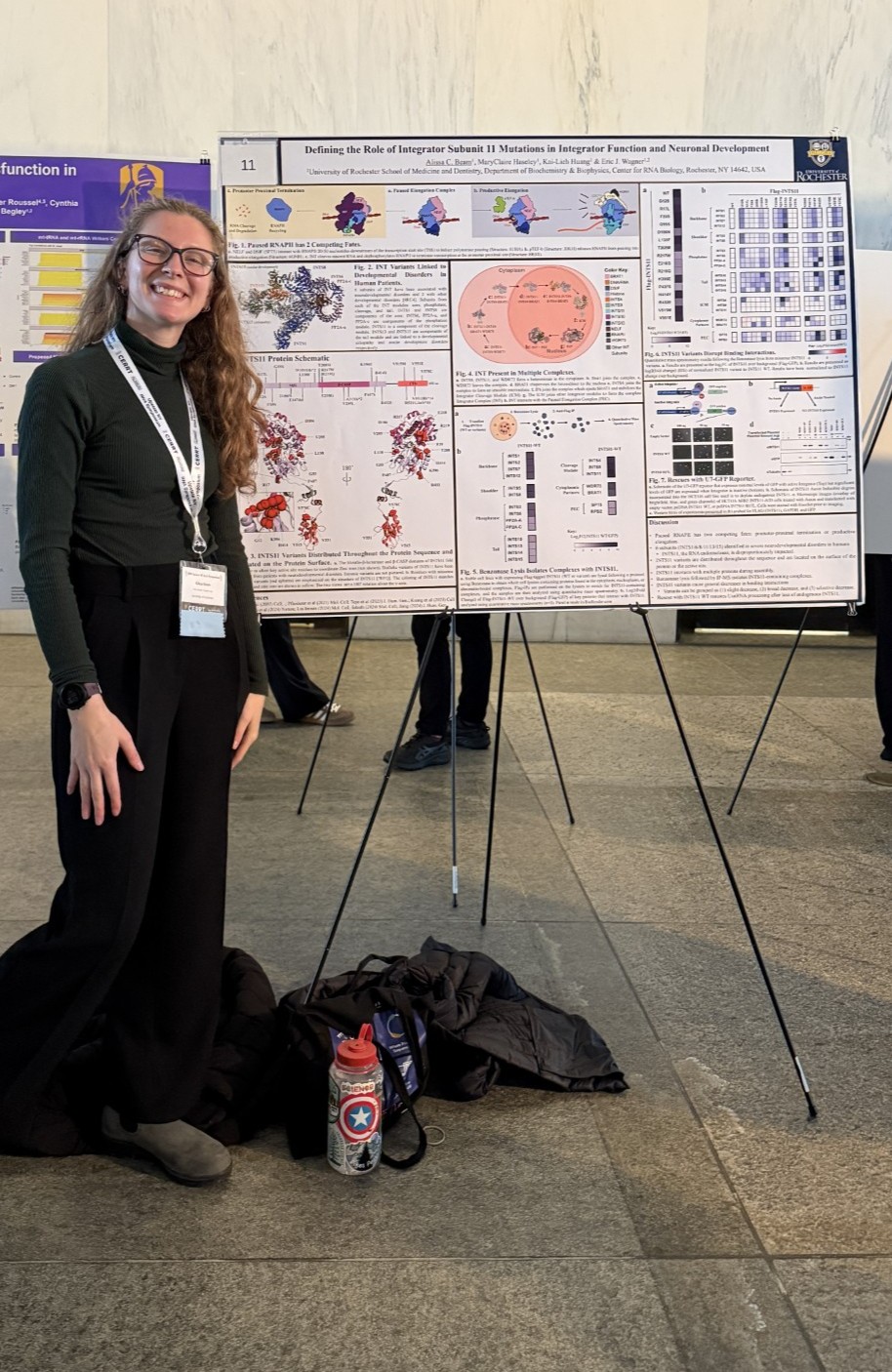 Alissa Beam in front of her poster at the conference