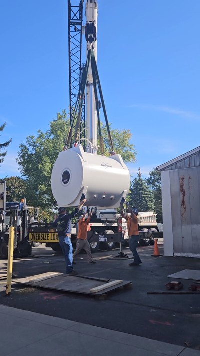 Crane lifting the 9.4T Bruker animal MRI to UR CABIN